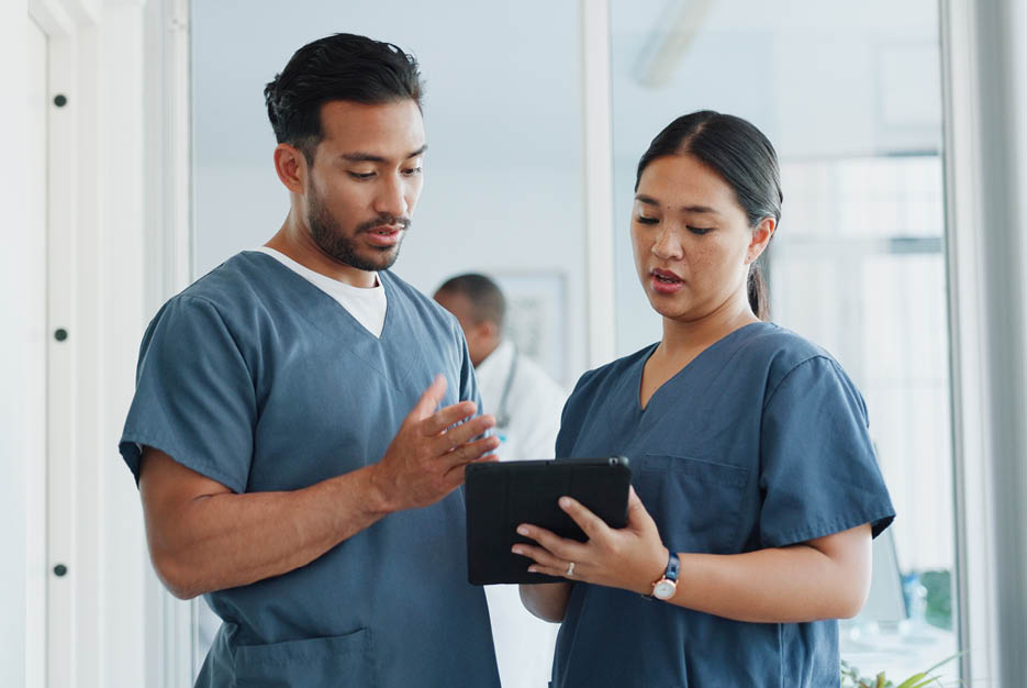 Medical advice, help and doctors with a tablet for healthcare, research and medicine planning  Communication, collaboration and men working in cardiology talking about surgery results on technology 